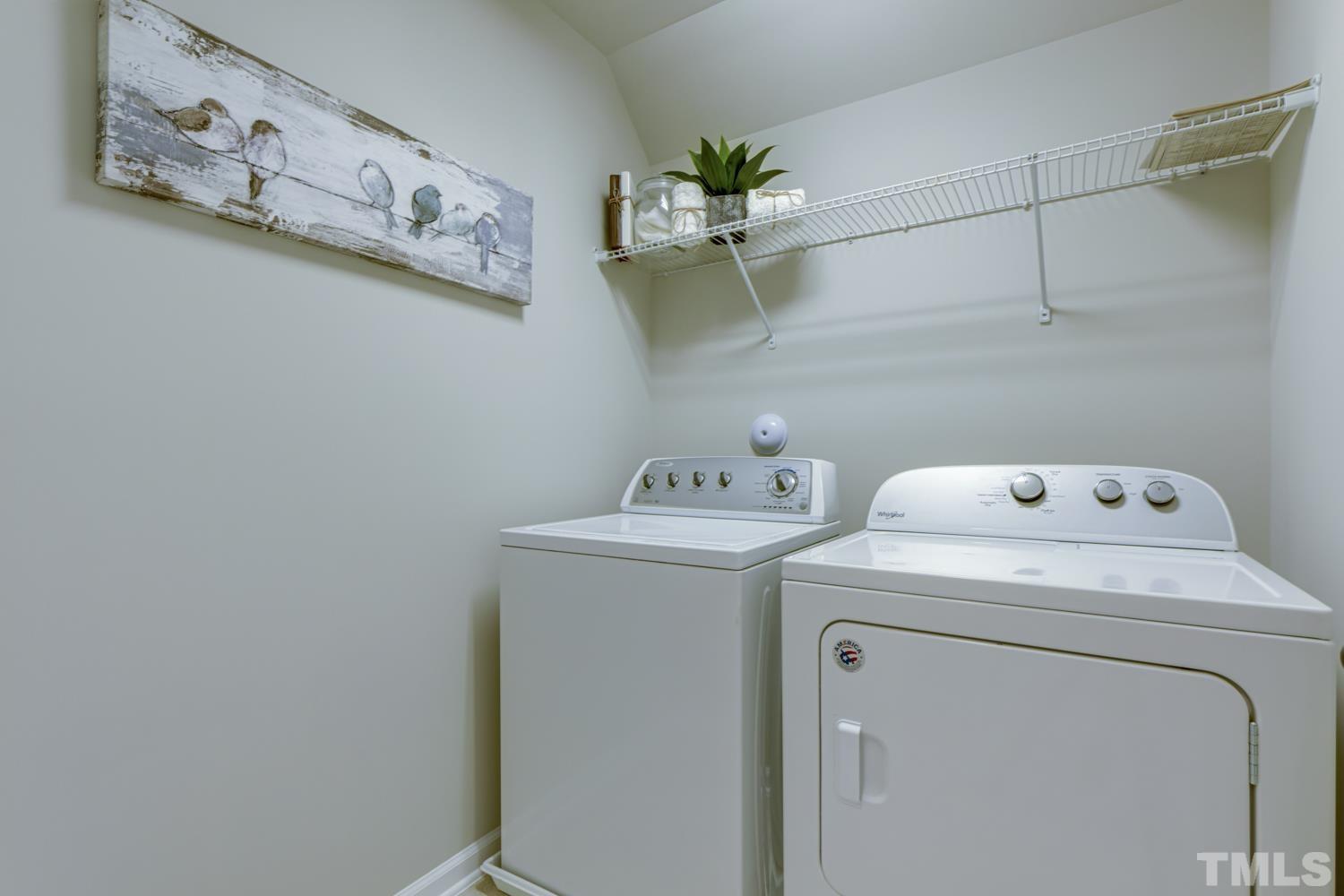 125 Victorian Oaks Drive Durham, NC 27713 - Photo 10 of 15 Conveniently located on the 2nd floor, the laundry room has nice shelving for additional storage space. There is also a large double closet/linen closet as well.