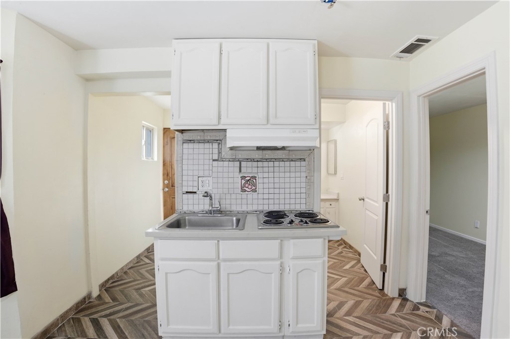 1581 West Chanticleer Road, Unit B Anaheim, CA 92802 - Photo 5 of 13 a kitchen with stainless steel appliances a cabinets and a counter top space