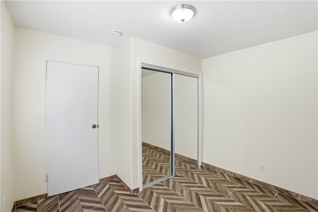 1581 West Chanticleer Road, Unit B Anaheim, CA 92802 - Photo 6 of 13 a bedroom with a bed and a window