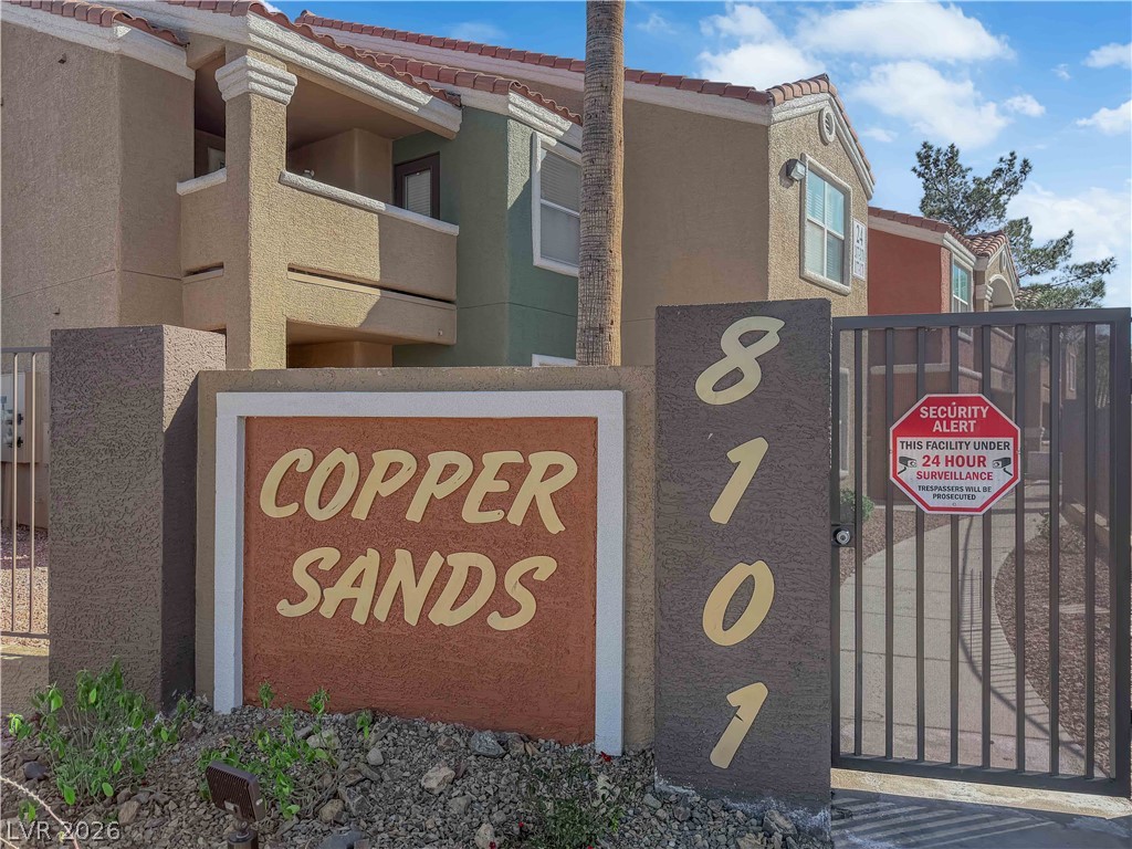 8101 West Flamingo Road, Unit 2030 Las Vegas, NV 89147 - Photo 13 of 27 Secure community entrance with an inviting Copper Sands monument sign.