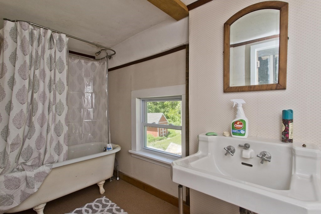 806 Colebrook River Road Tolland, MA 01034 - Photo 11 of 17 a bathroom with a sink and a bathtub