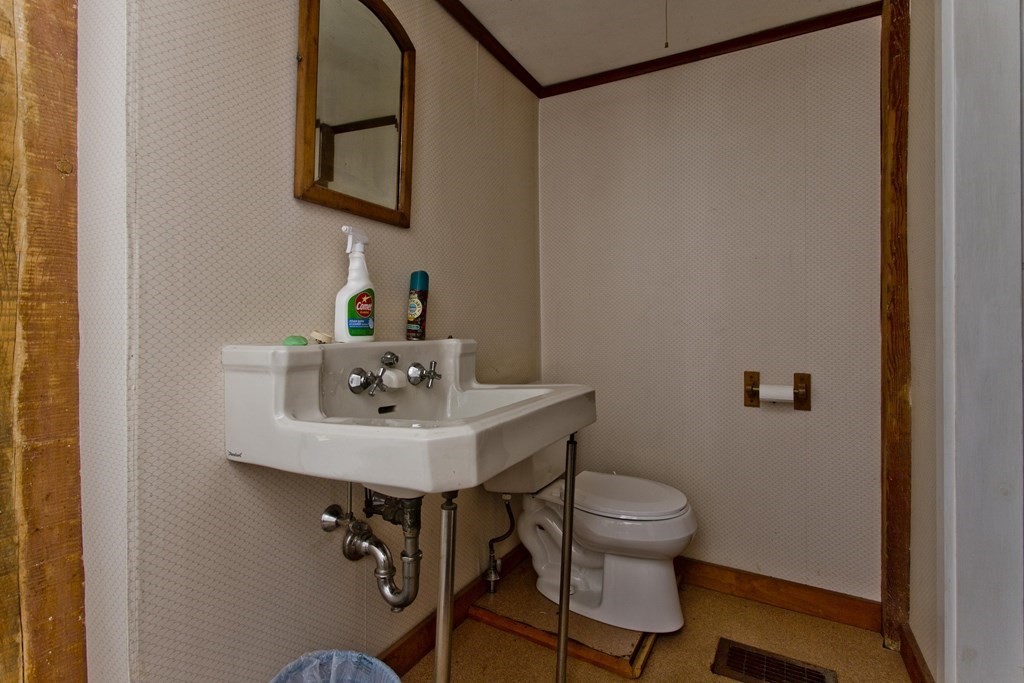 806 Colebrook River Road Tolland, MA 01034 - Photo 12 of 17 a bathroom with a sink a toilet and mirror
