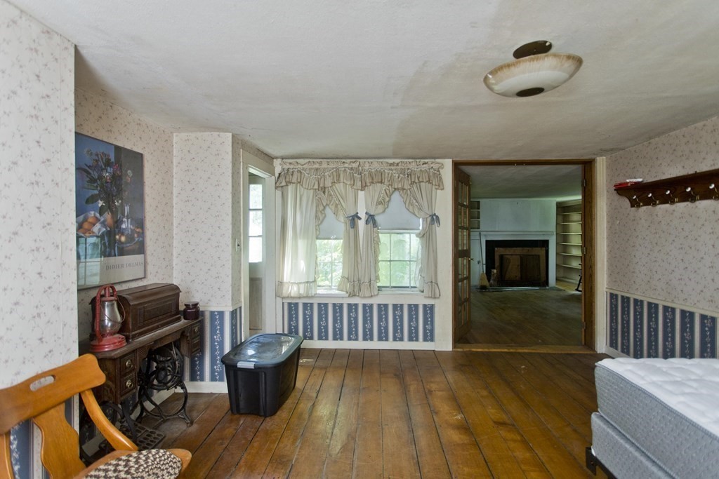 806 Colebrook River Road Tolland, MA 01034 - Photo 10 of 17 a living room with furniture and a window