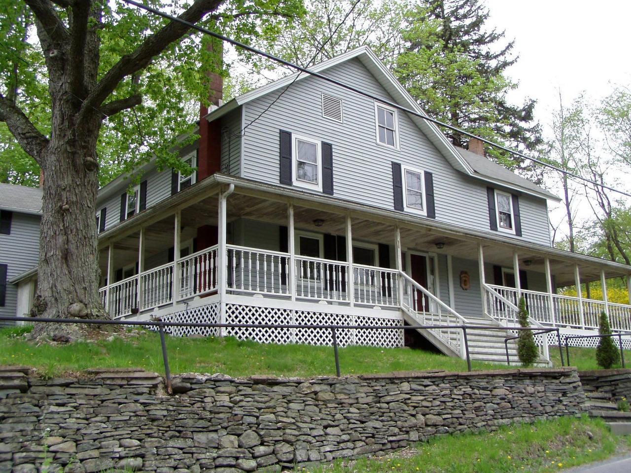 Spruce Cabin Road Cresco, PA 18326 - Photo 2 of 17 a house that has a window in front of a house