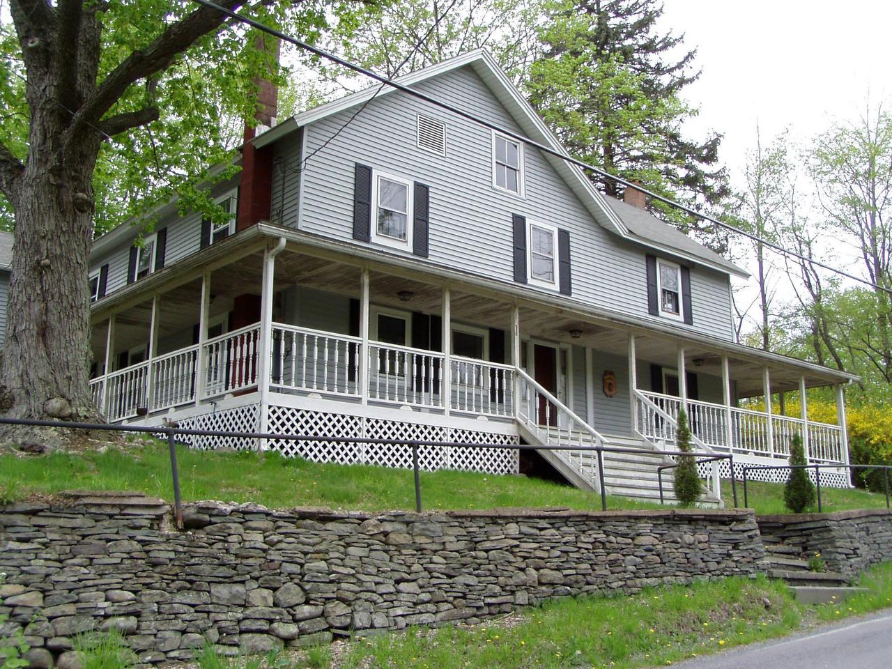 Spruce Cabin Road Cresco, PA 18326 - Photo 3 of 17 a house with a trees in the background