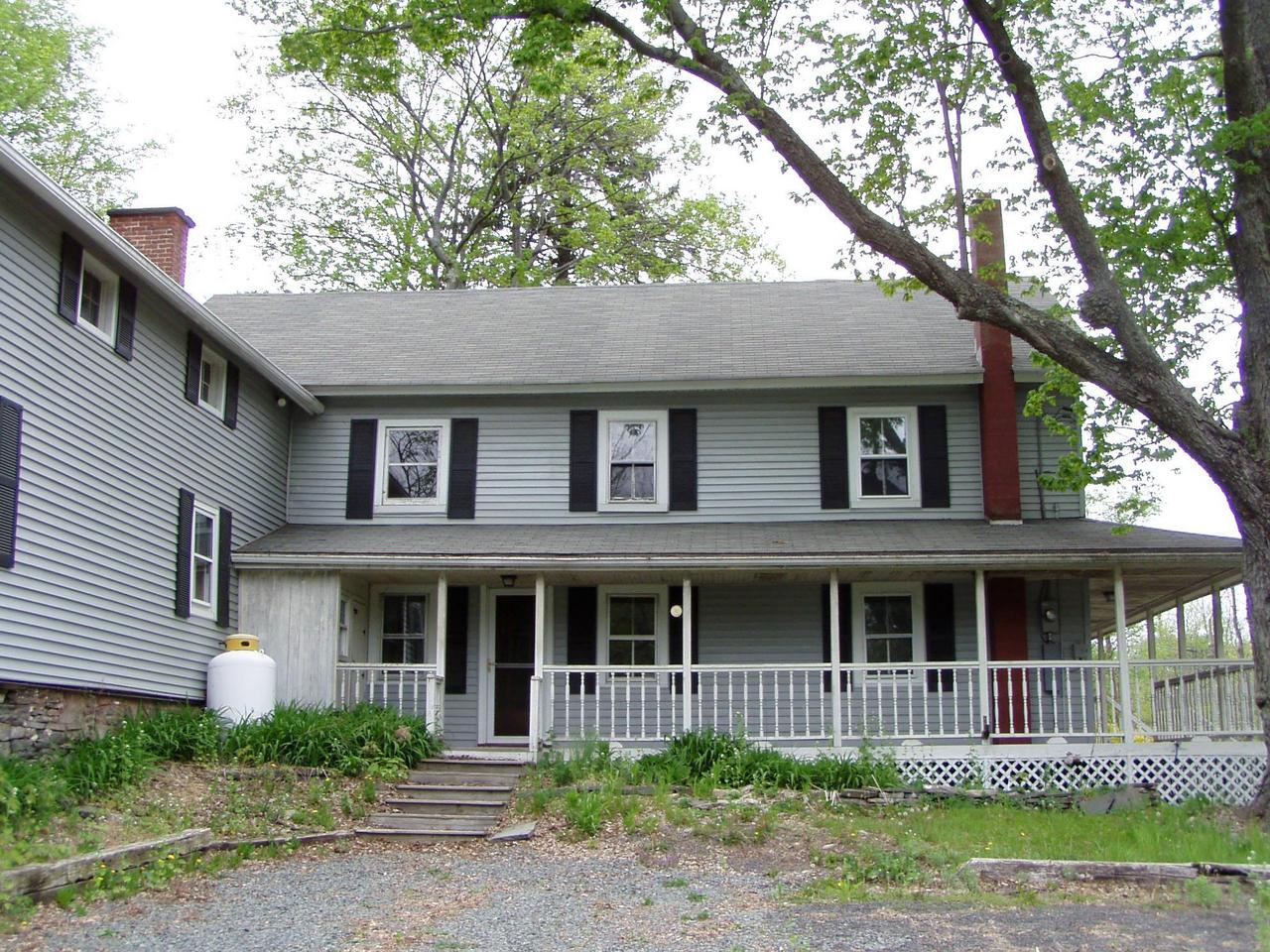 Spruce Cabin Road Cresco, PA 18326 - Photo 4 of 17 a front view of a house with a garden
