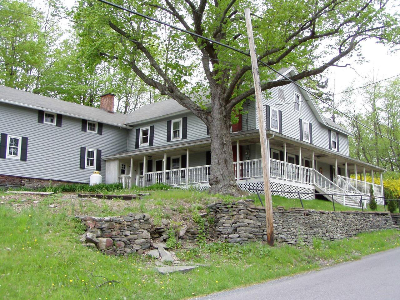 Spruce Cabin Road Cresco, PA 18326 - Photo 5 of 17 a front view of a house with a yard
