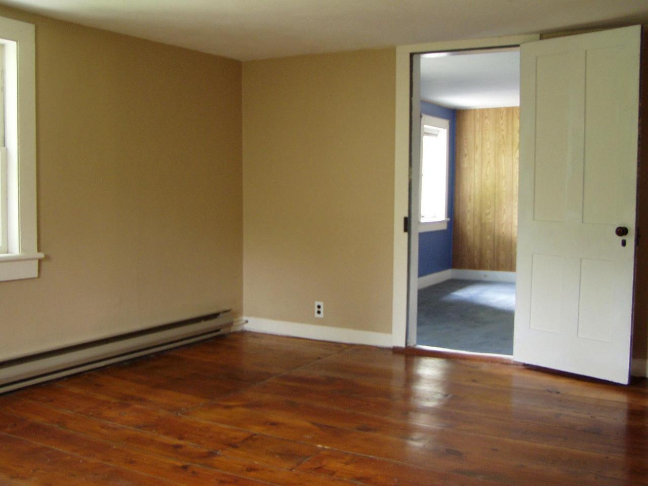 Spruce Cabin Road Cresco, PA 18326 - Photo 7 of 17 an empty room with wooden floor and windows