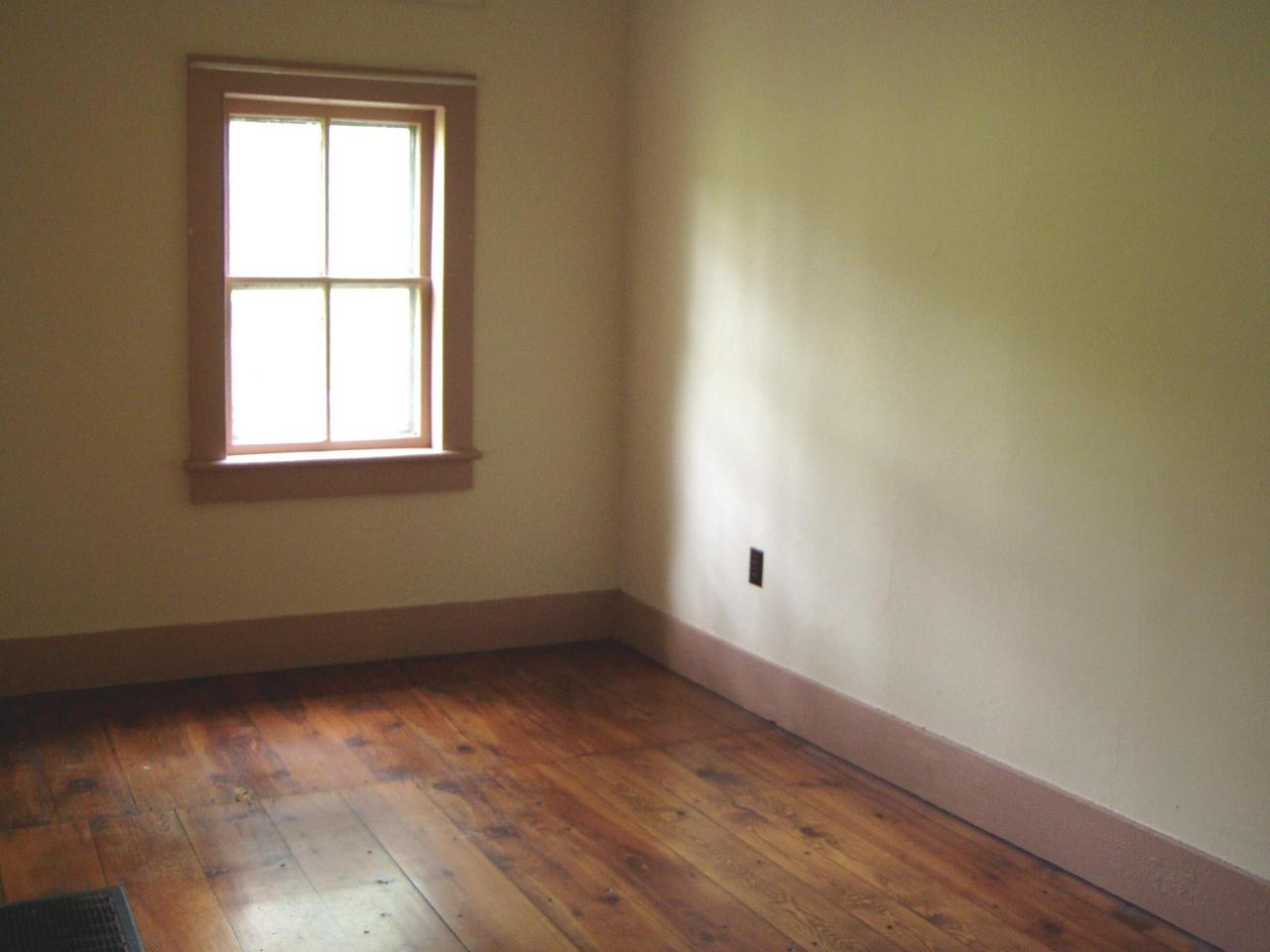 Spruce Cabin Road Cresco, PA 18326 - Photo 8 of 17 an empty room with wooden floor and windows