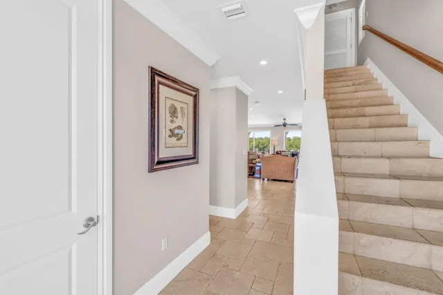 a very nice looking living room with a large window and furniture