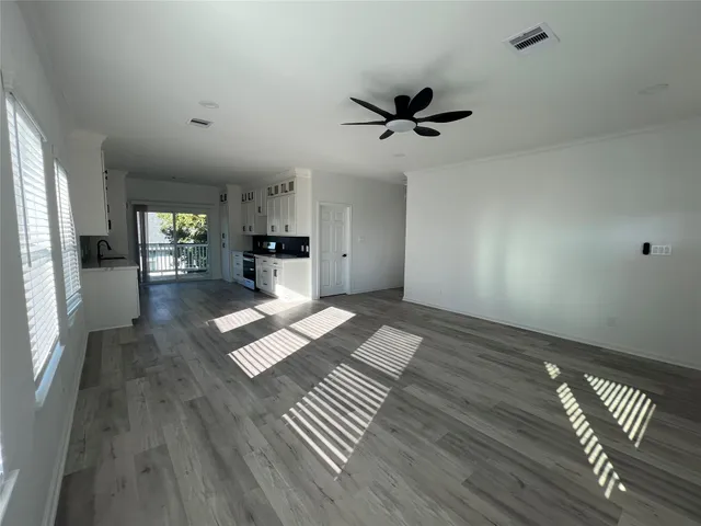 a view of a living room and wooden floor