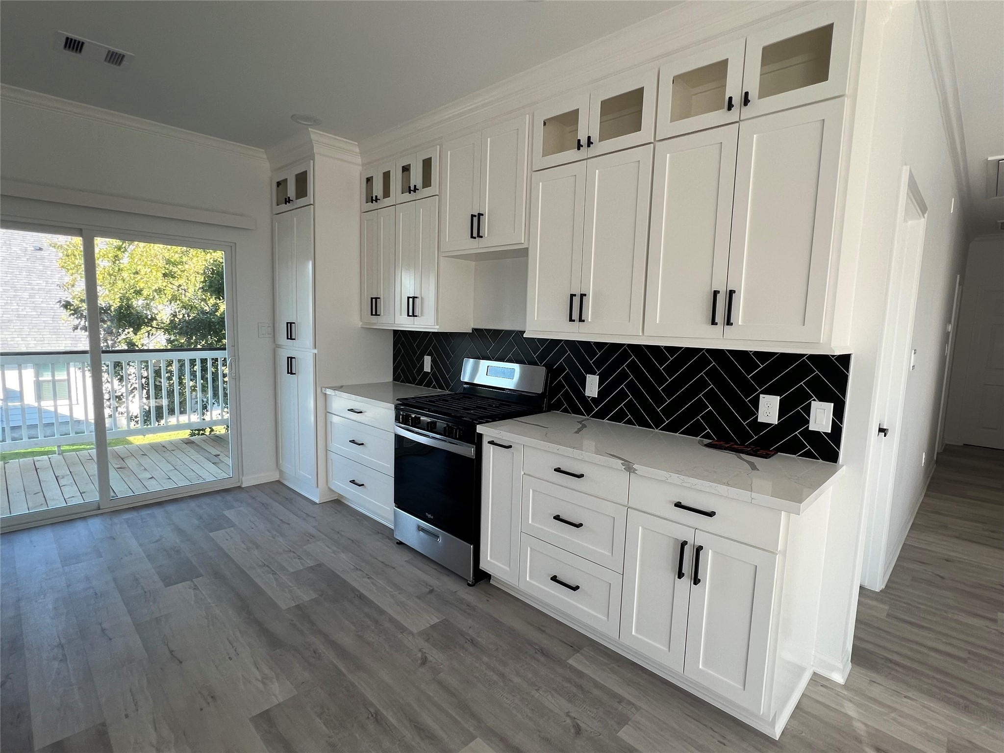 226 South Y La Porte, TX 77571 - Photo 5 of 21 a kitchen with stainless steel appliances granite countertop a stove and a wooden cabinets