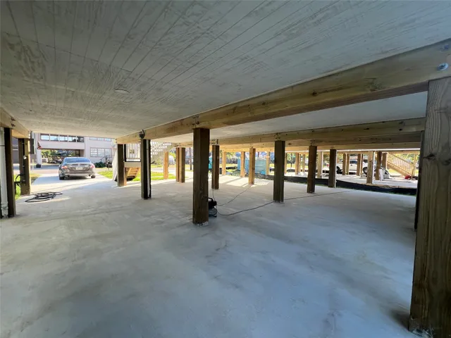 a view of an empty room and entrance door