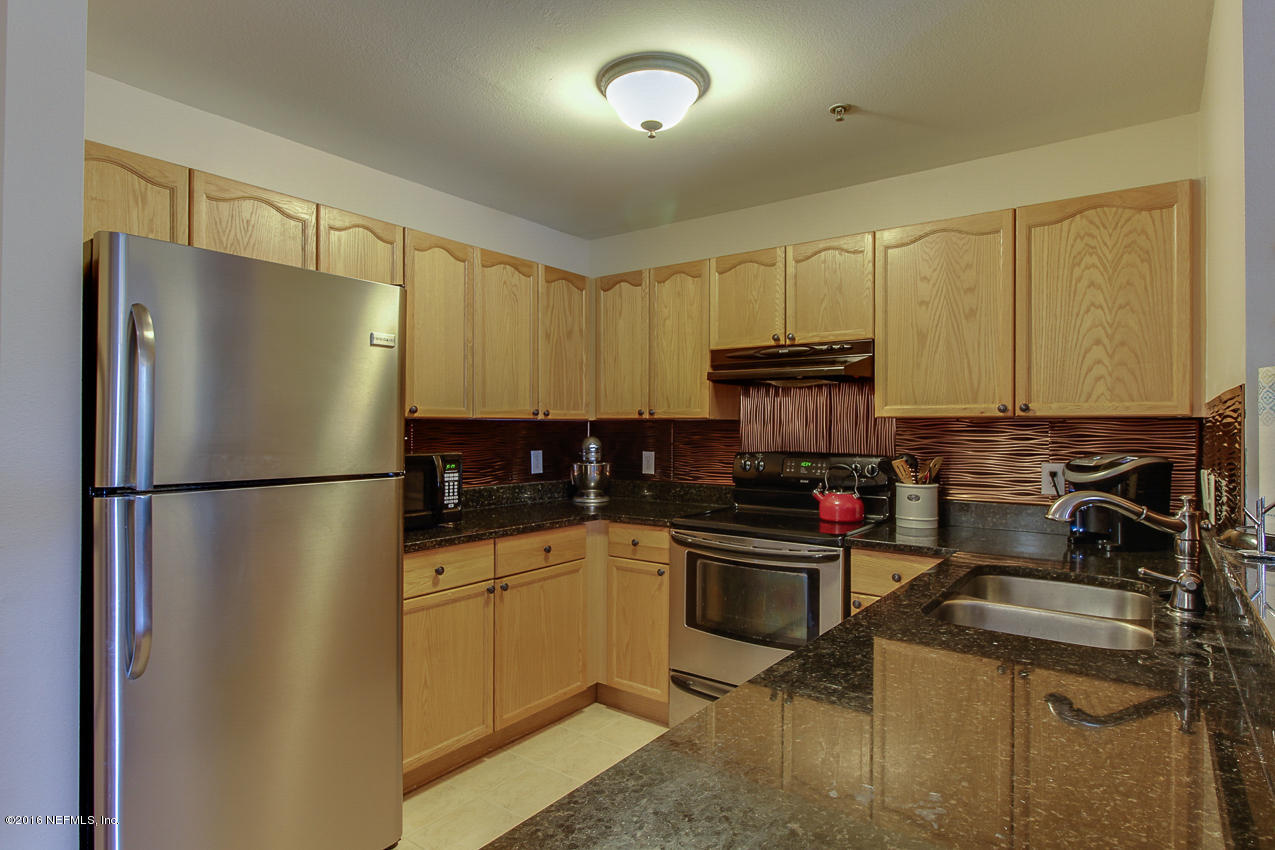 23583 Bahama Point Fernandina Beach, FL 32034 - Photo 12 of 37 a kitchen with a refrigerator sink and stove