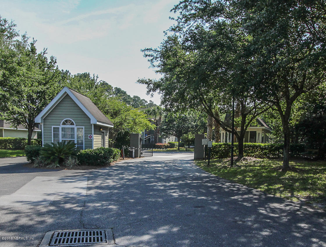 23583 Bahama Point Fernandina Beach, FL 32034 - Photo 18 of 37 a front view of a house with garden