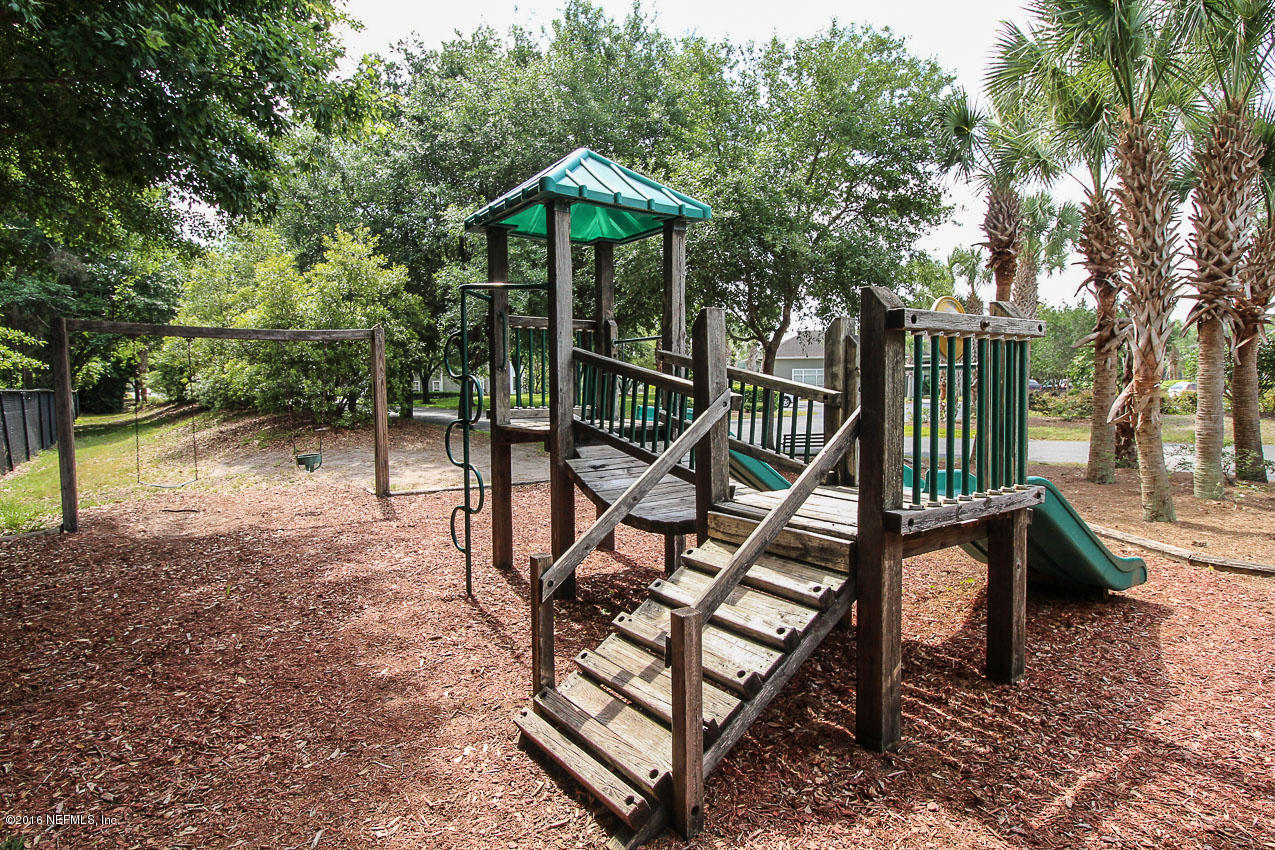 23583 Bahama Point Fernandina Beach, FL 32034 - Photo 25 of 37 a view of a bench in a backyard