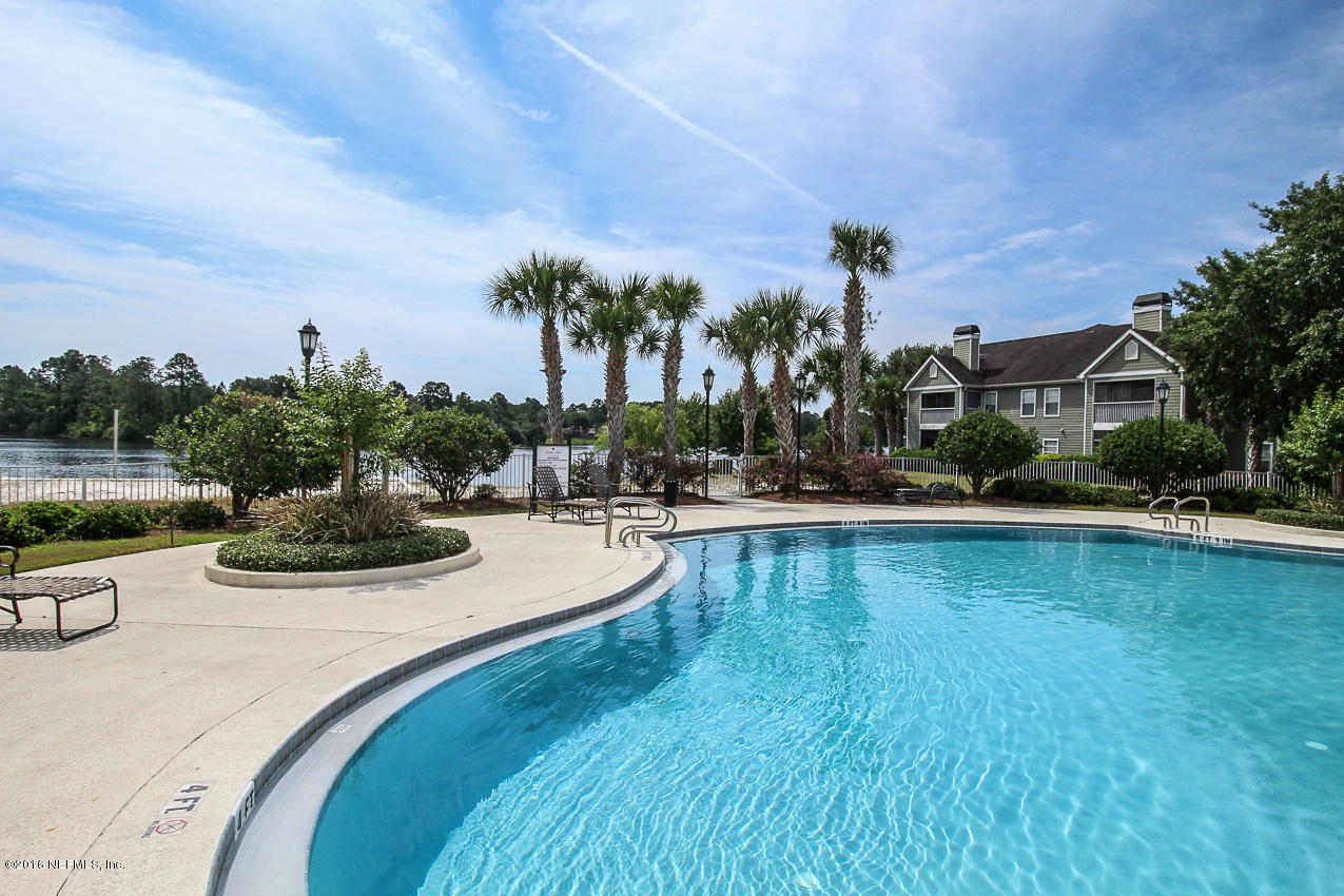 23583 Bahama Point Fernandina Beach, FL 32034 - Photo 29 of 37 a view of a swimming pool with outdoor seating and plants