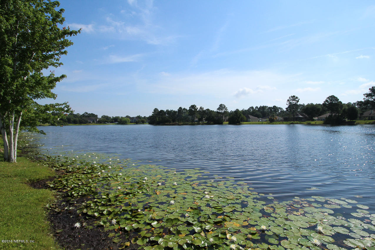 23583 Bahama Point Fernandina Beach, FL 32034 - Photo 35 of 37 a view of a lake with houses in the back