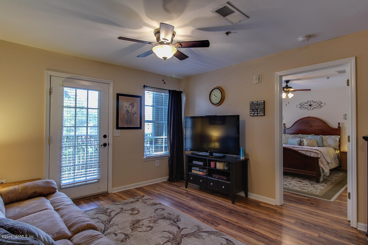 23583 Bahama Point Fernandina Beach, FL 32034 - Photo 6 of 37 a living room with furniture and a flat screen tv