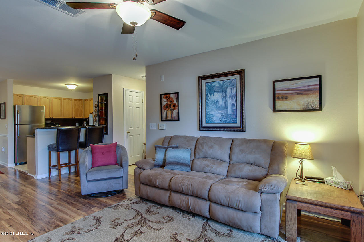 23583 Bahama Point Fernandina Beach, FL 32034 - Photo 7 of 37 a living room with furniture and kitchen view