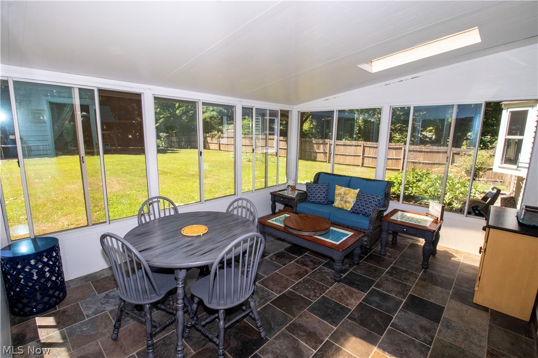 5480 Lockwood Road Madison, OH 44057 - Photo 23 of 30 Screened in patio with beautiful tile floors