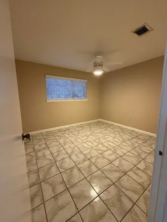 a view of an empty room and window