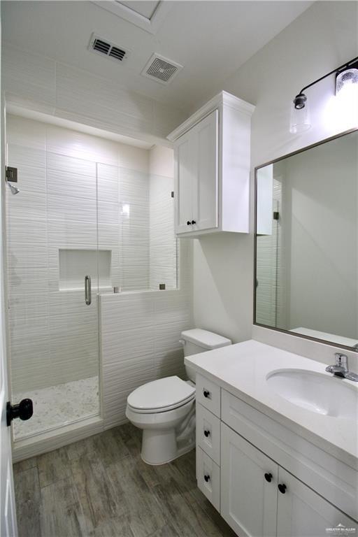 1610 Hooper Street, Unit 10 San Juan, TX 78589 - Photo 6 of 14 a bathroom with a sink a toilet and shower