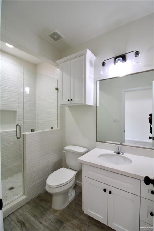 1610 Hooper Street, Unit 10 San Juan, TX 78589 - Photo 7 of 14 a bathroom with a sink toilet and shower