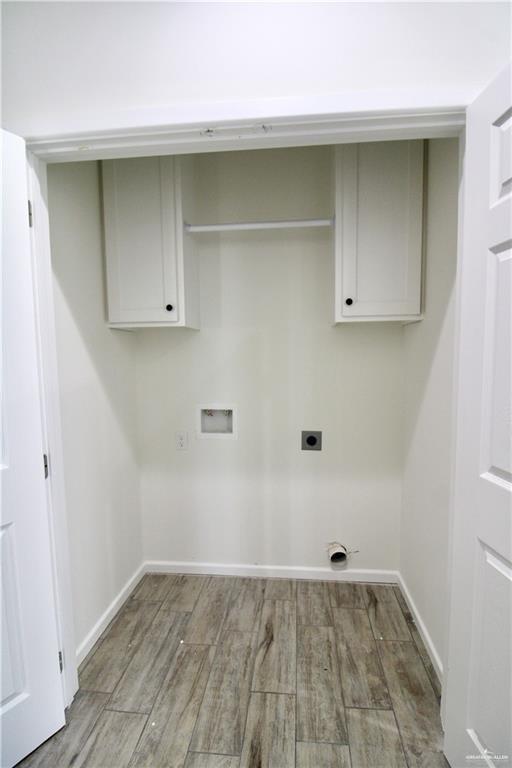1610 Hooper Street, Unit 10 San Juan, TX 78589 - Photo 9 of 14 a view of a room with wooden floor and cabinet