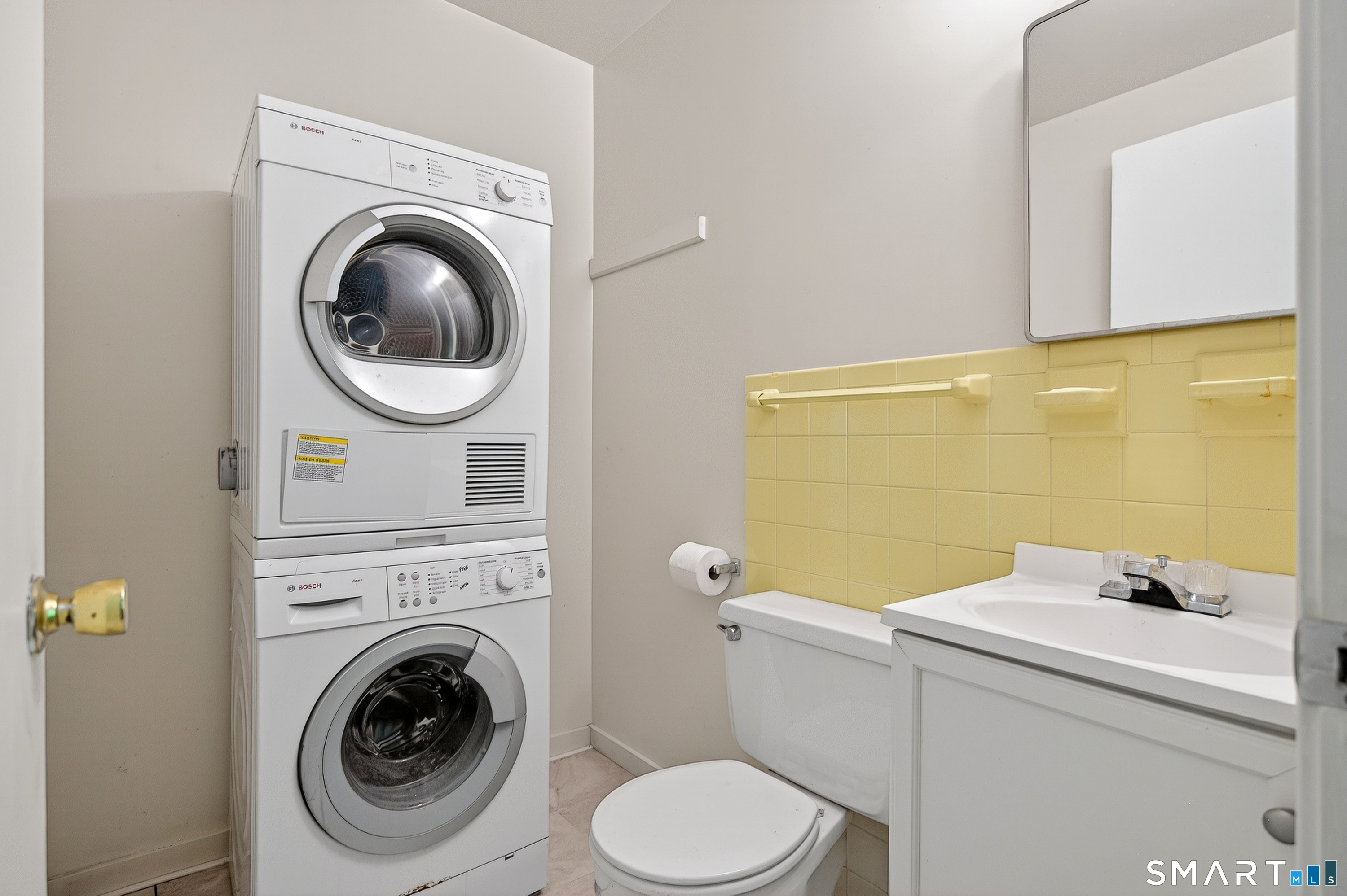4 Pepper Pond Road Sherman, CT 06784 - Photo 18 of 33 a bathroom with a sink and a washer dryer