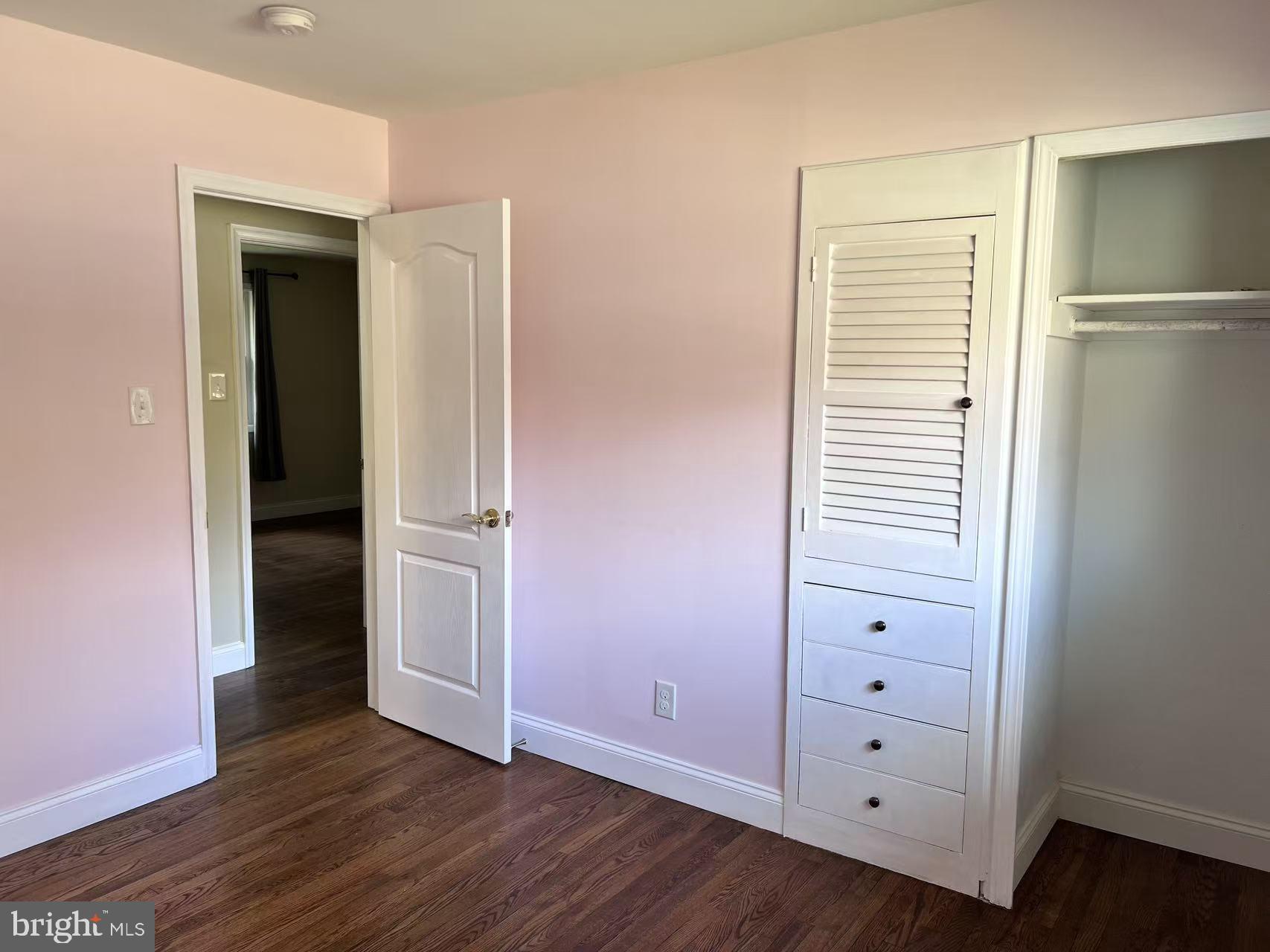 4106 Southend Road Rockville, MD 20853 - Photo 24 of 36 an empty room with wooden floor closet and windows