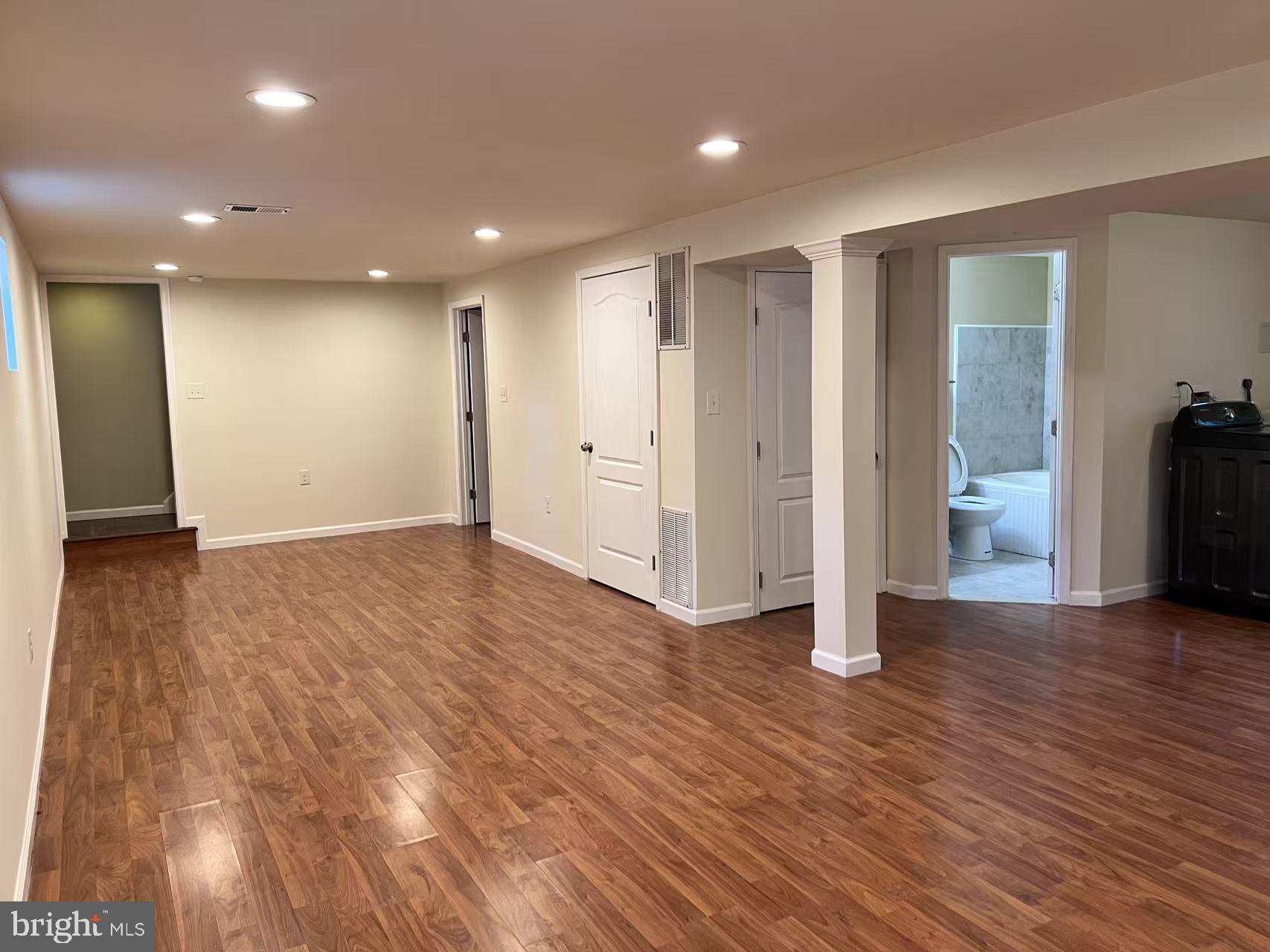 4106 Southend Road Rockville, MD 20853 - Photo 33 of 36 a view of empty room with wooden floor