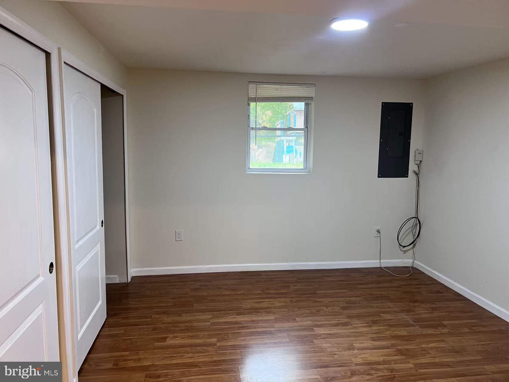 4106 Southend Road Rockville, MD 20853 - Photo 35 of 36 a view of an empty room with wooden floor and a window