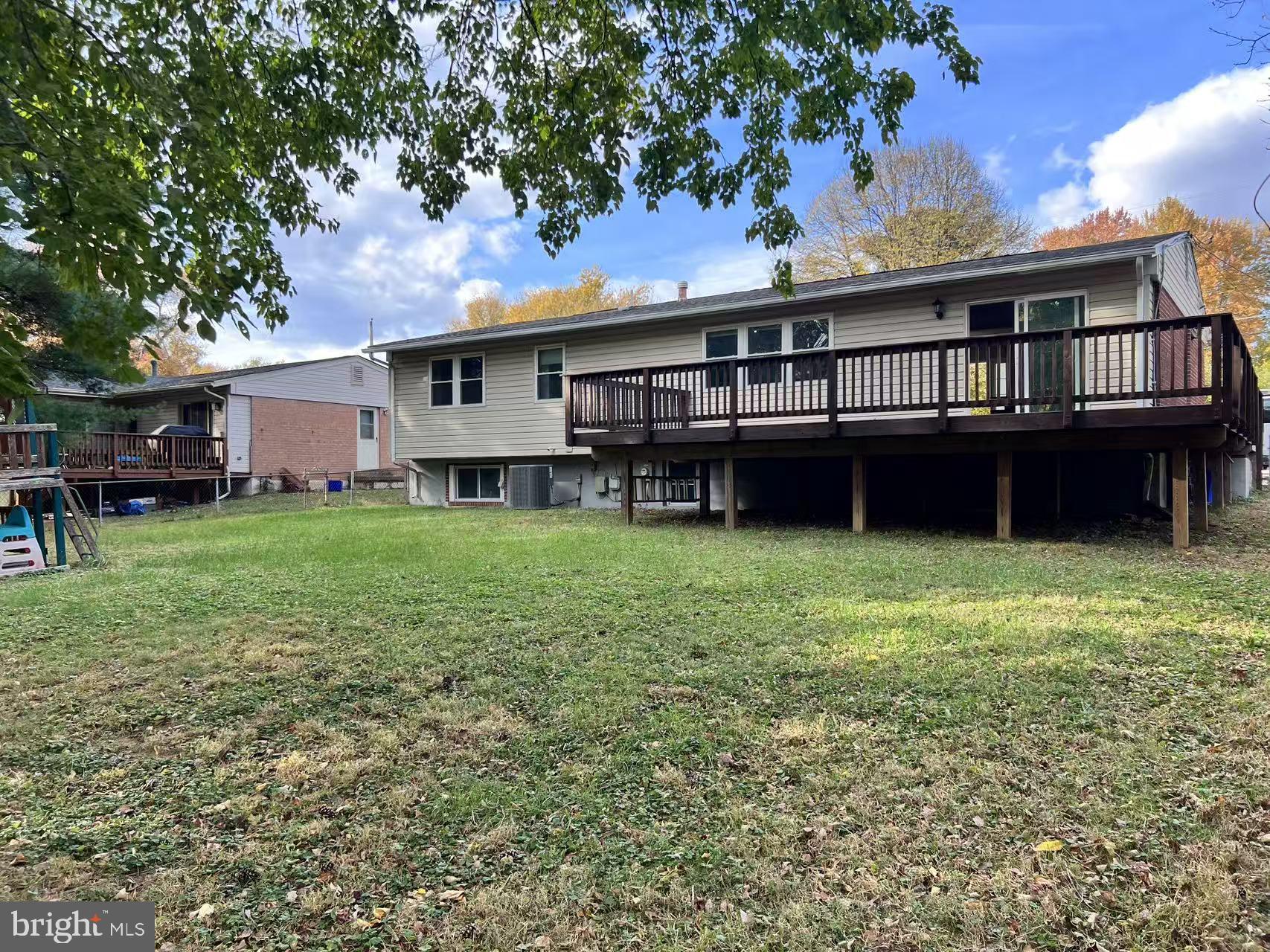 4106 Southend Road Rockville, MD 20853 - Photo 7 of 36 a house that has a big yard and large trees