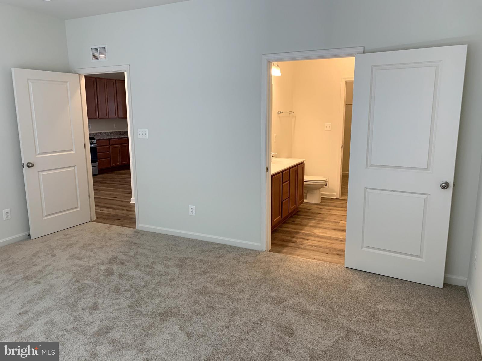 263 Trails Way Joppa, MD 21085 - Photo 9 of 27 an empty room with windows and closet