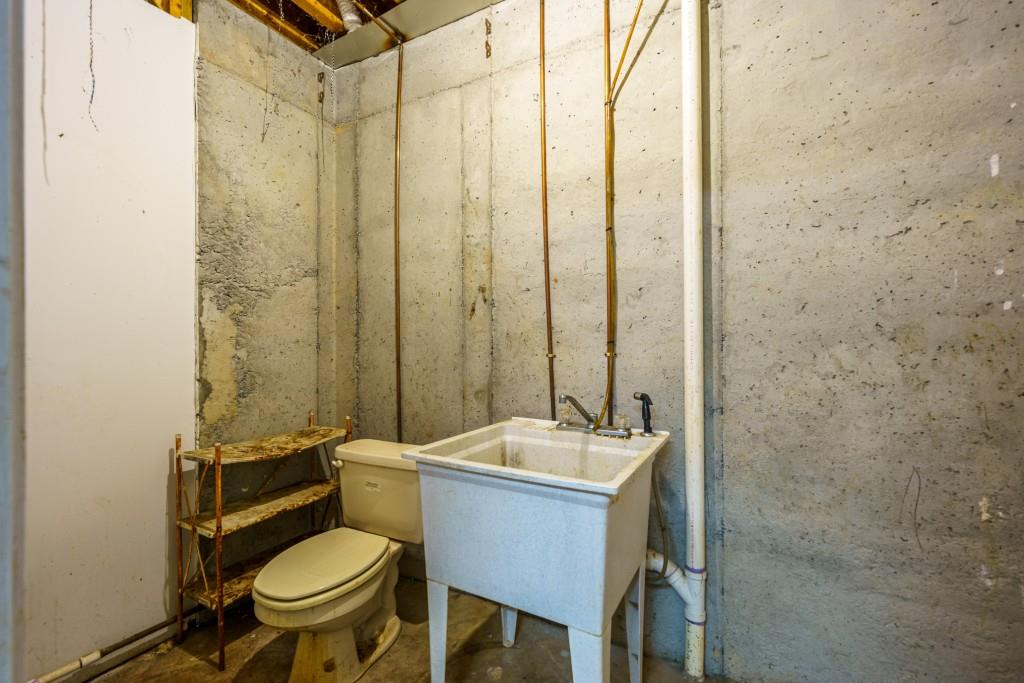 176 Big Oak Tree Road Northwest Adairsville, GA 30103 - Photo 52 of 77 a bathroom with a sink and a mirror