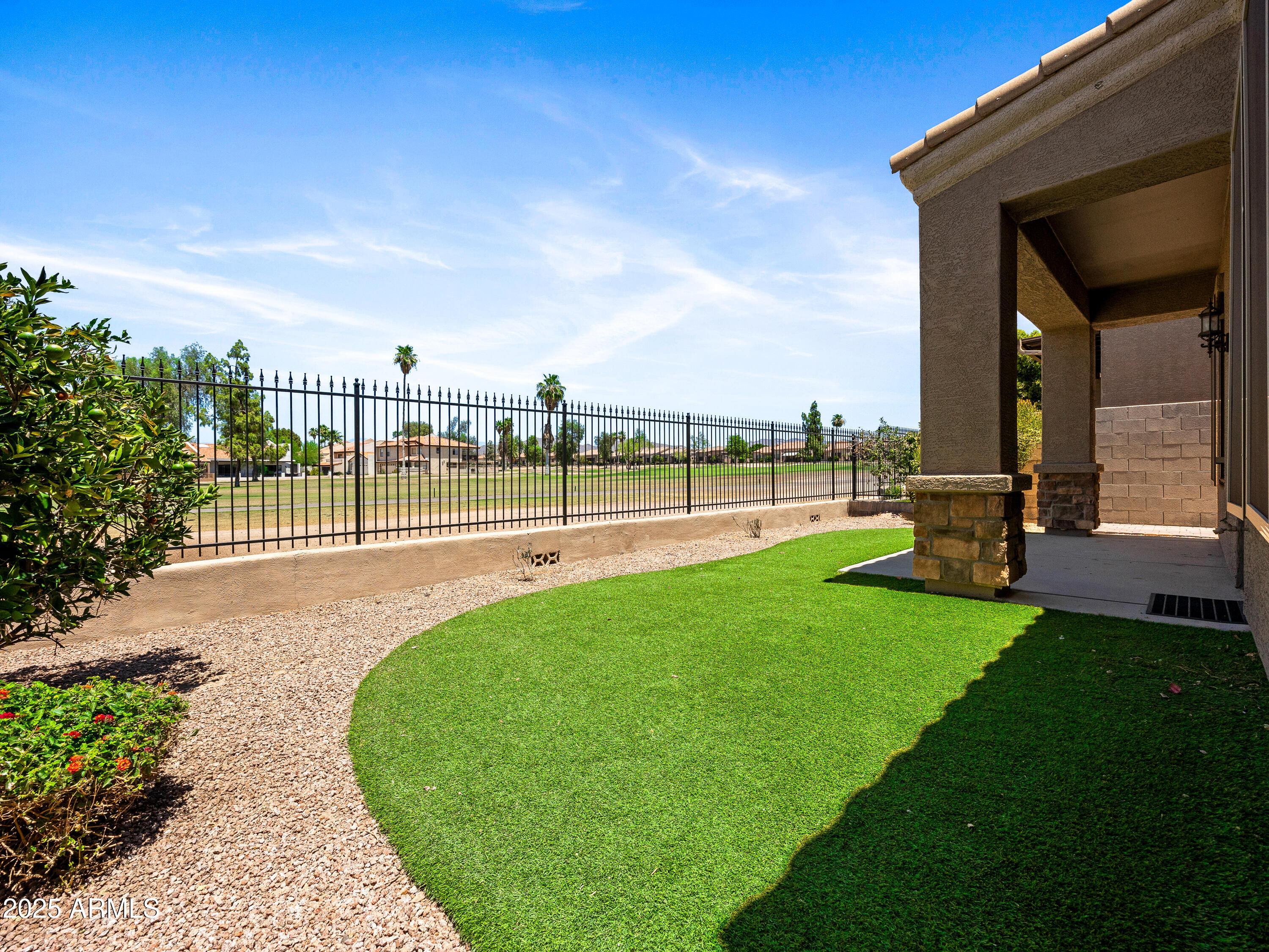 6202 East McKellips Road, Unit 83 Mesa, AZ 85215 - Photo 17 of 54 a view of a garden with a large tree