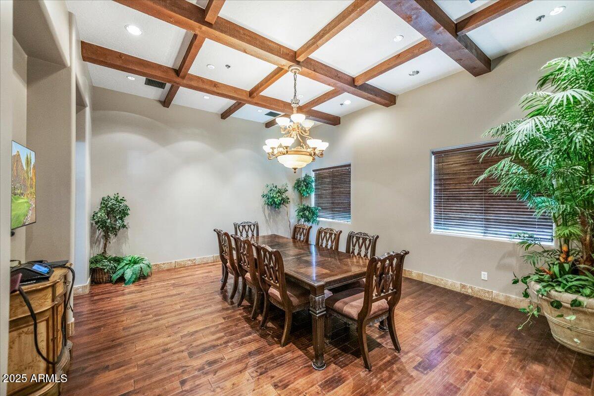 6202 East McKellips Road, Unit 83 Mesa, AZ 85215 - Photo 21 of 54 a view of a dining room with furniture and wooden floor