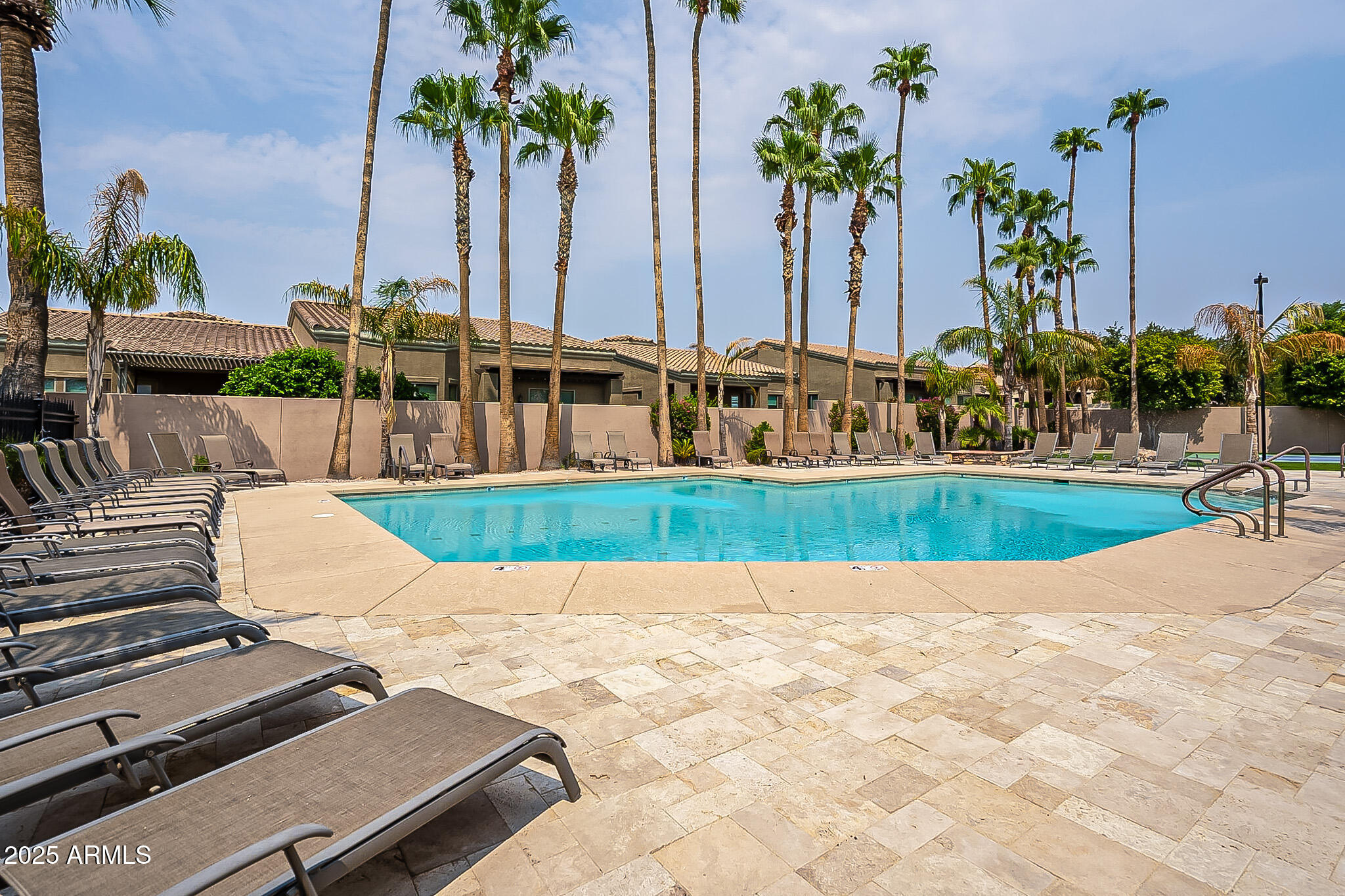 6202 East McKellips Road, Unit 83 Mesa, AZ 85215 - Photo 25 of 54 a view of swimming pool with outdoor seating and plants