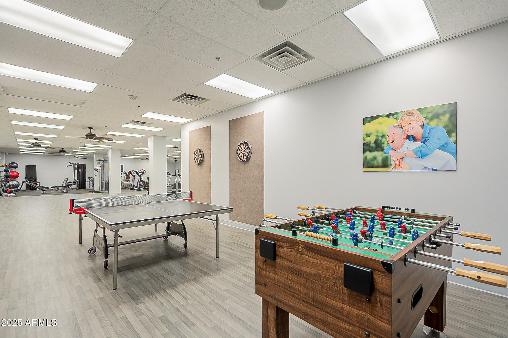 6202 East McKellips Road, Unit 83 Mesa, AZ 85215 - Photo 41 of 54 a living room with furniture and a dining table with wooden floor