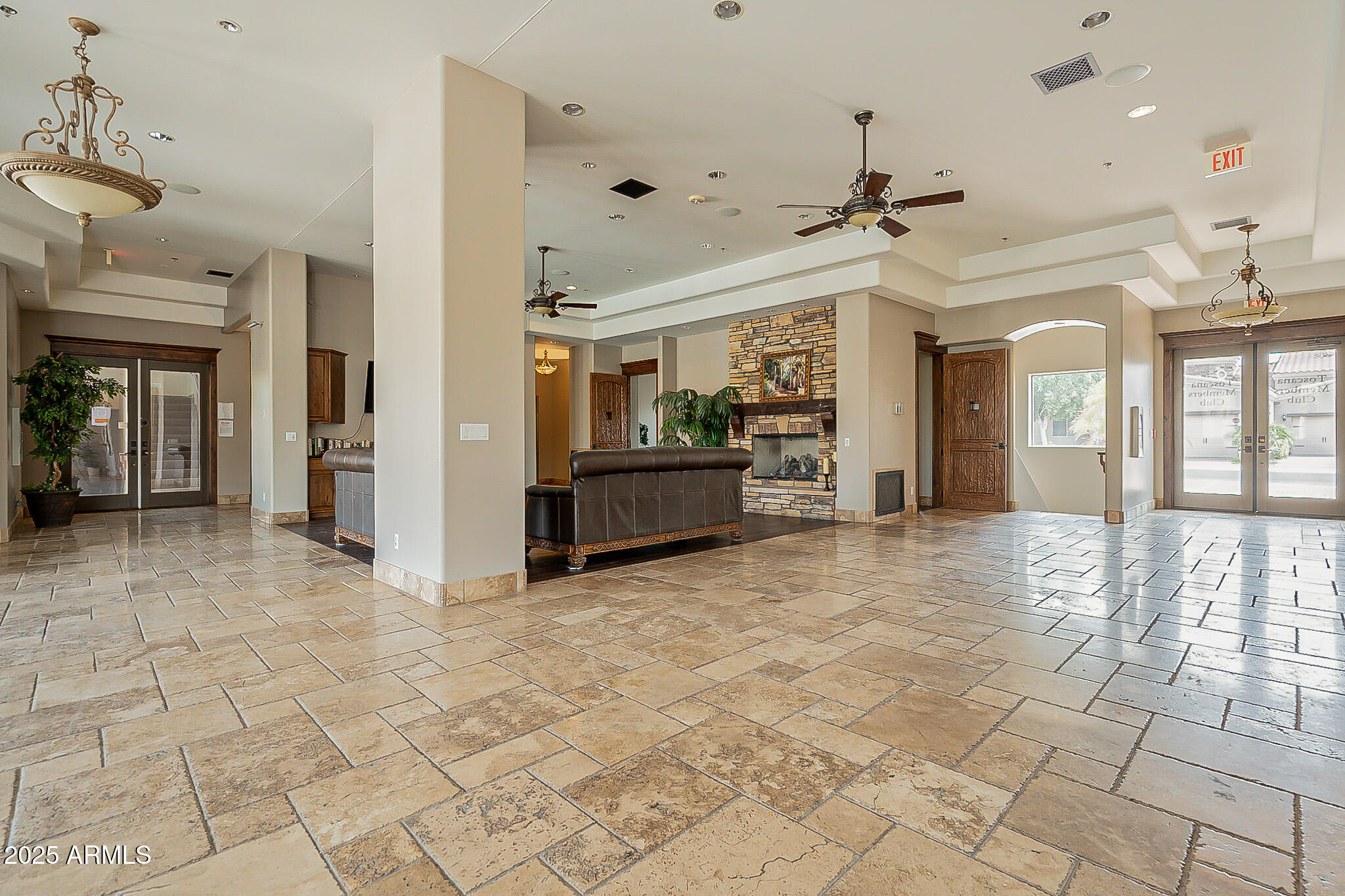 6202 East McKellips Road, Unit 83 Mesa, AZ 85215 - Photo 45 of 54 a view of a hallway with entryway and chandelier