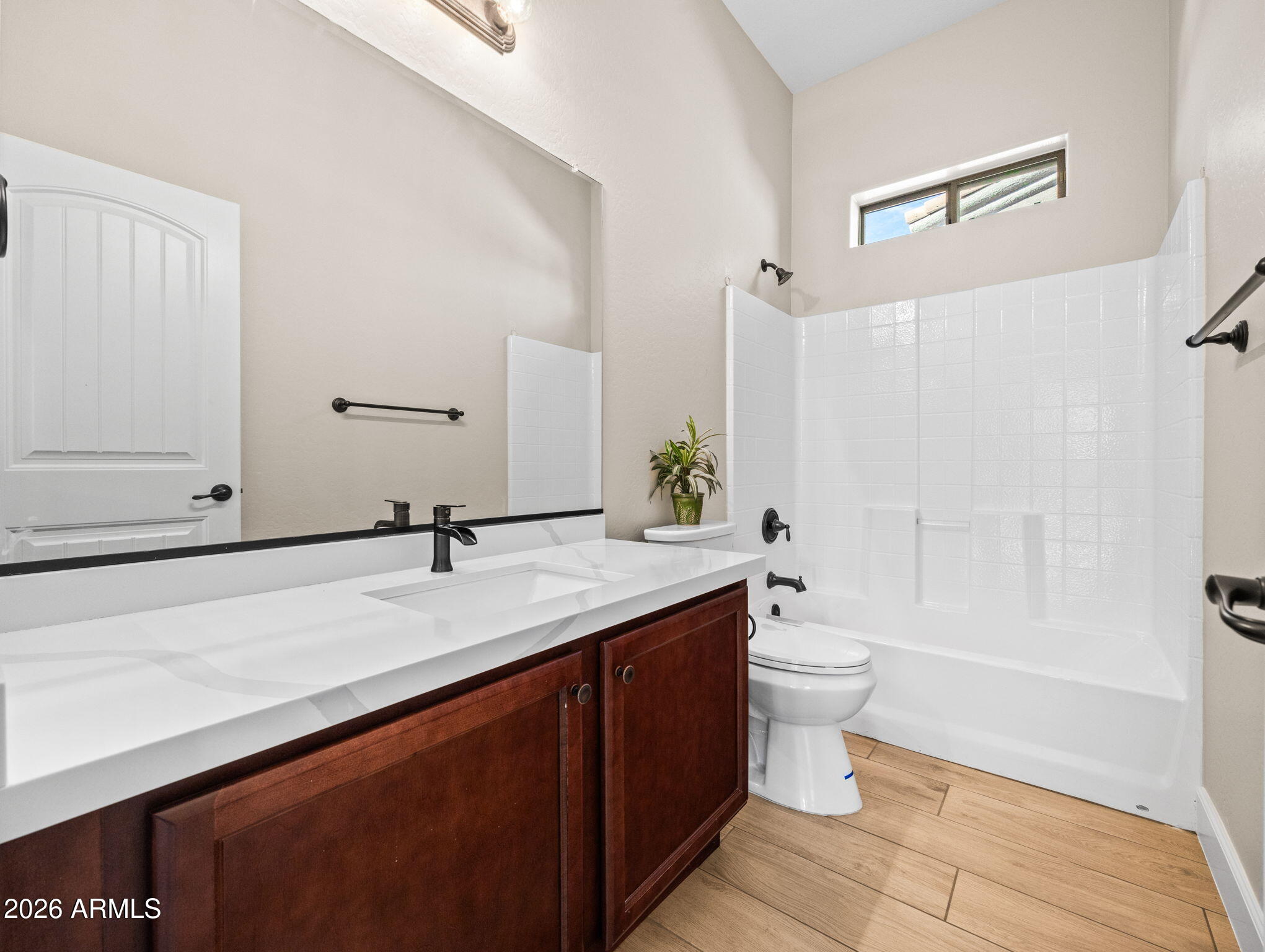 6202 East McKellips Road, Unit 83 Mesa, AZ 85215 - Photo 7 of 54 a bathroom with a double vanity sink toilet and shower
