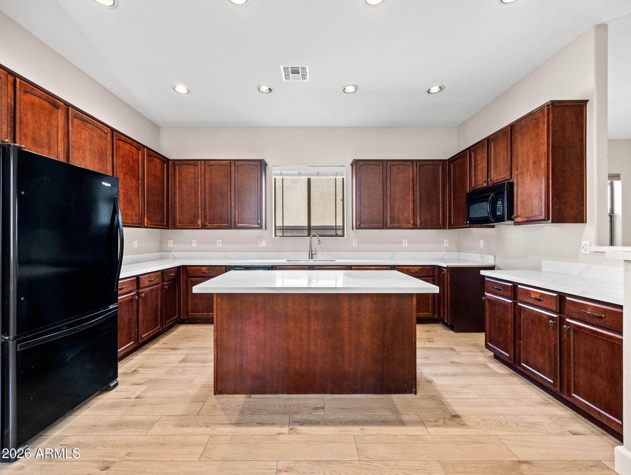 6202 East McKellips Road, Unit 83 Mesa, AZ 85215 - Photo 10 of 54 a kitchen with stainless steel appliances granite countertop a stove a sink dishwasher a refrigerator and a microwave oven
