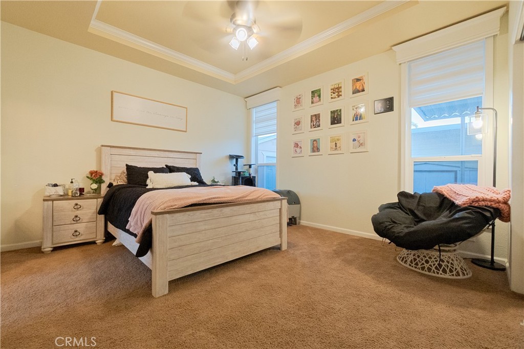 626 North Dearborn, Unit 150 Redlands, CA 92374 - Photo 22 of 32 a bedroom with a bed and a couch