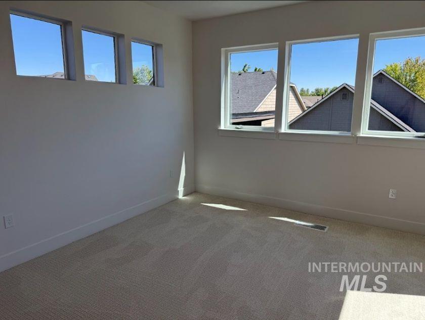 755 West Wrangler Street Meridian, ID 83646 - Photo 20 of 35 Bright interior room featuring a neutral color palette