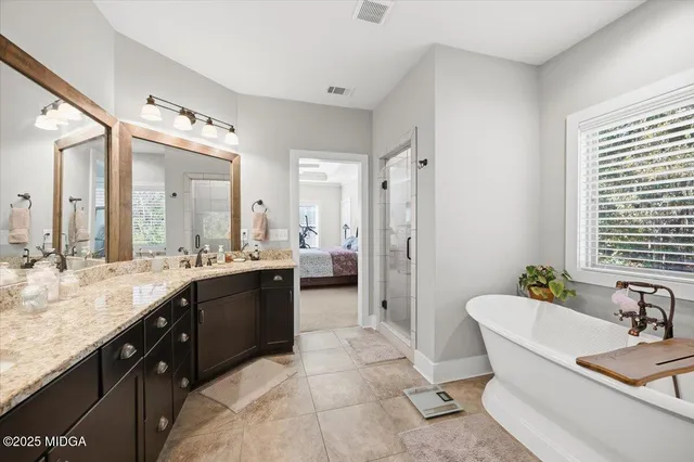 a bathroom with a sink double vanity and a mirror