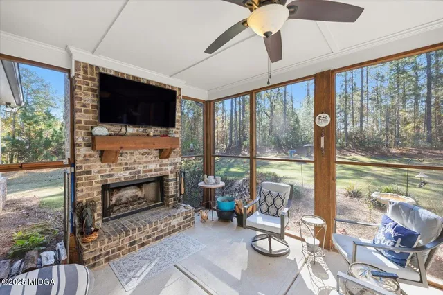 an aerial view of a house with a yard basket ball court and outdoor seating