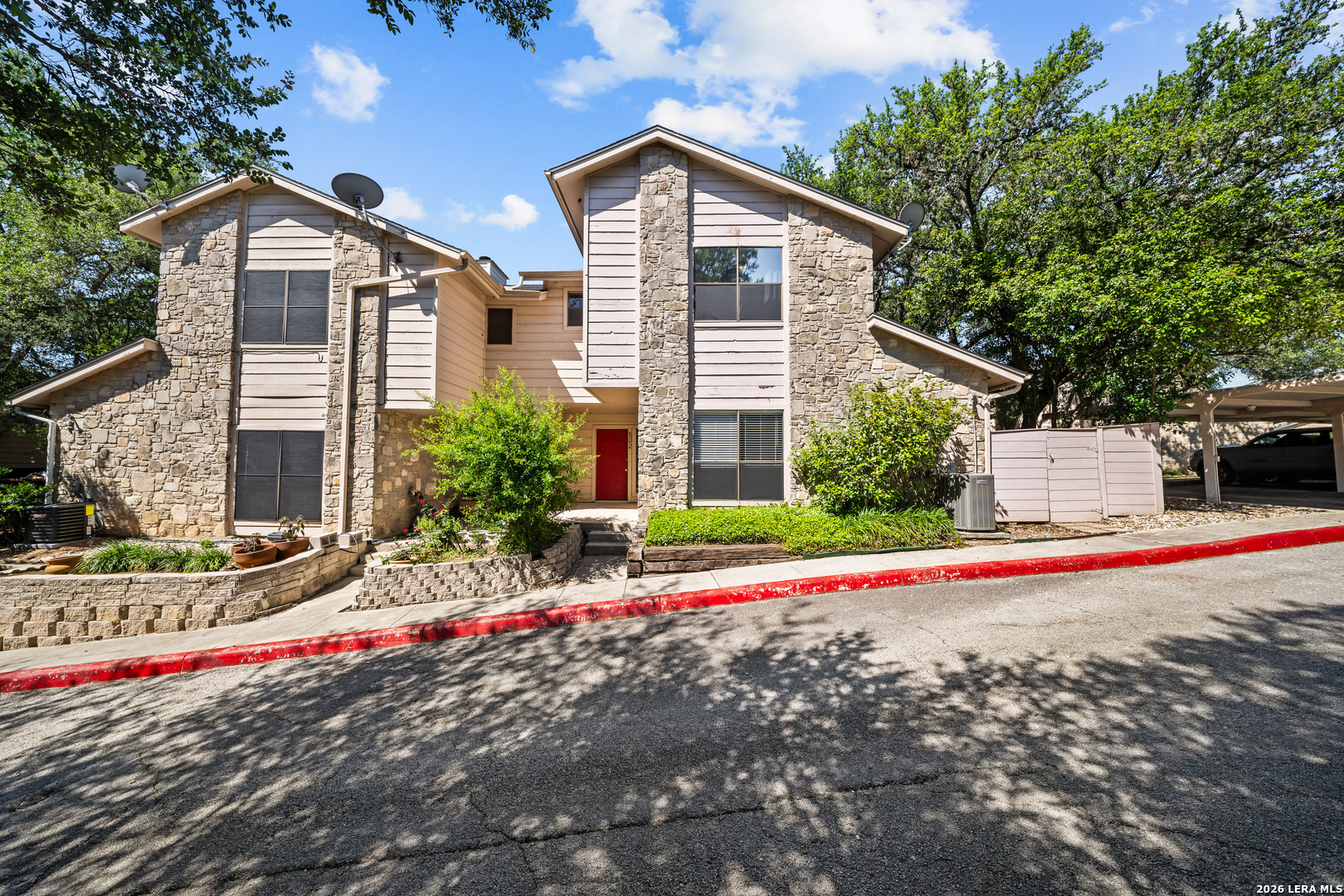829 West Bitters Road, Unit 502 San Antonio, TX 78216 - Photo 1 of 29 a front view of a house with a yard