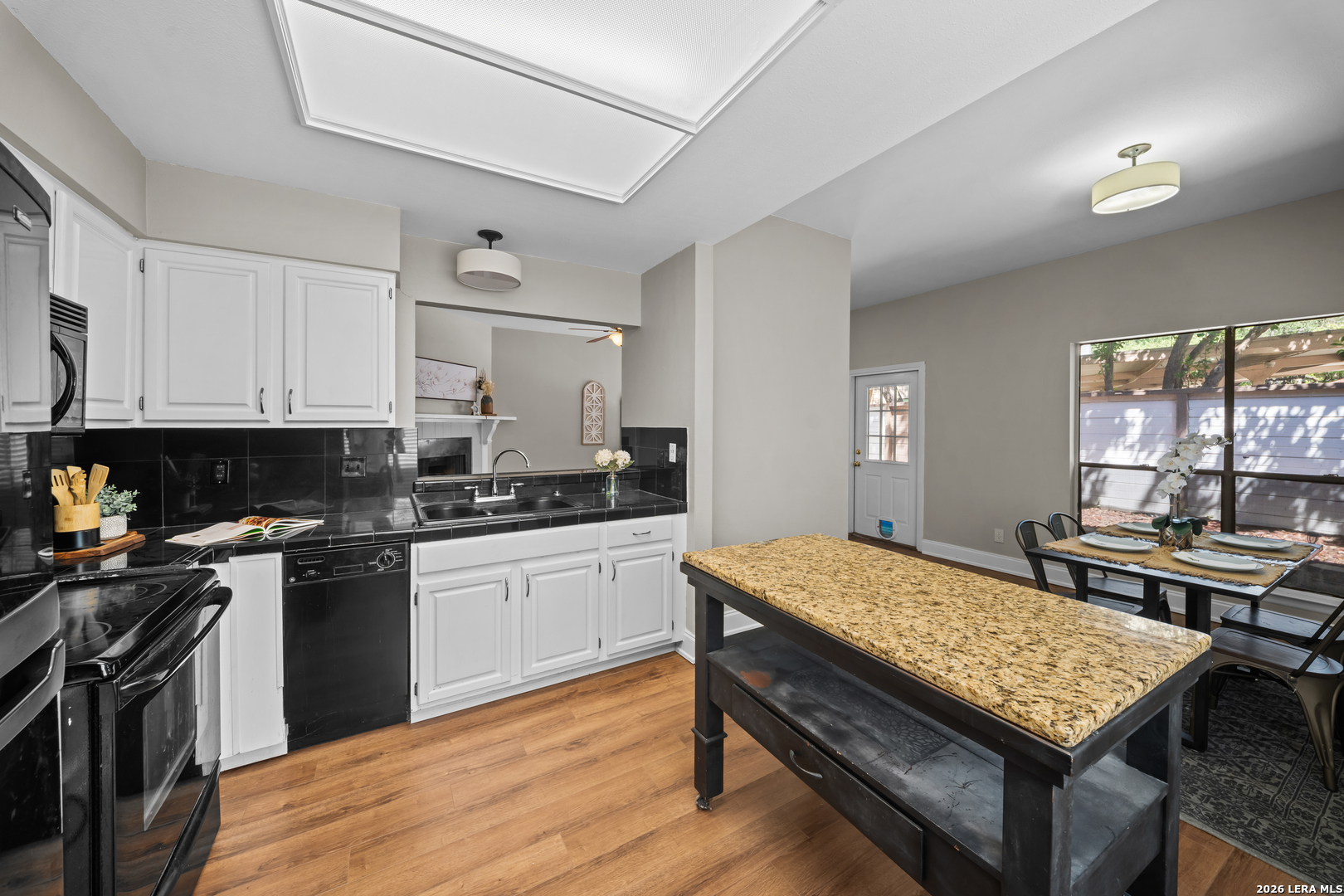 829 West Bitters Road, Unit 502 San Antonio, TX 78216 - Photo 11 of 29 a kitchen with a stove and a white cabinets