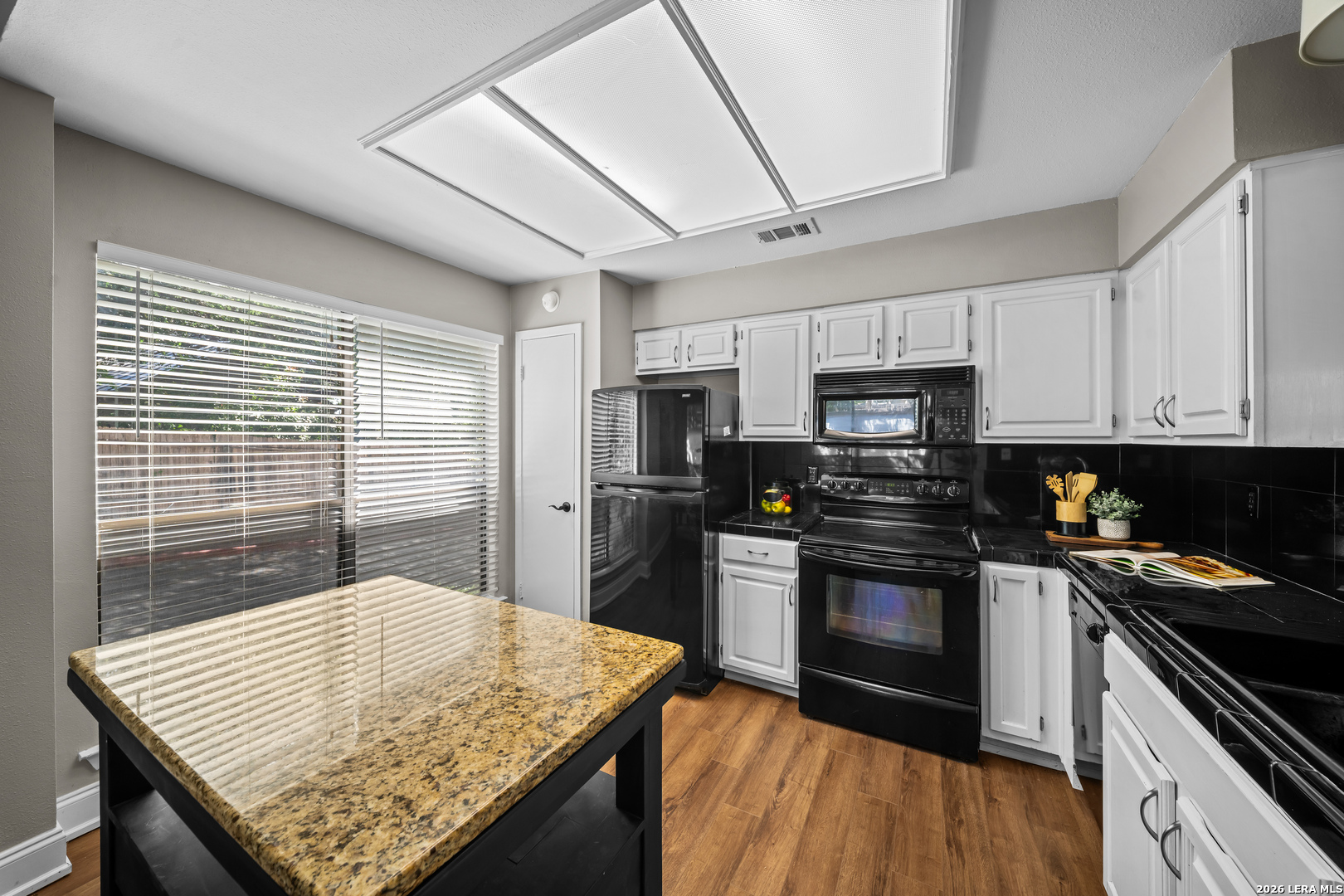 829 West Bitters Road, Unit 502 San Antonio, TX 78216 - Photo 12 of 29 a kitchen with stainless steel appliances granite countertop a sink stove and refrigerator